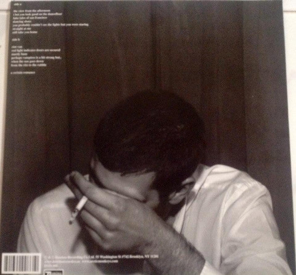 Arctic Monkeys Whatever People Say I Am contraportada